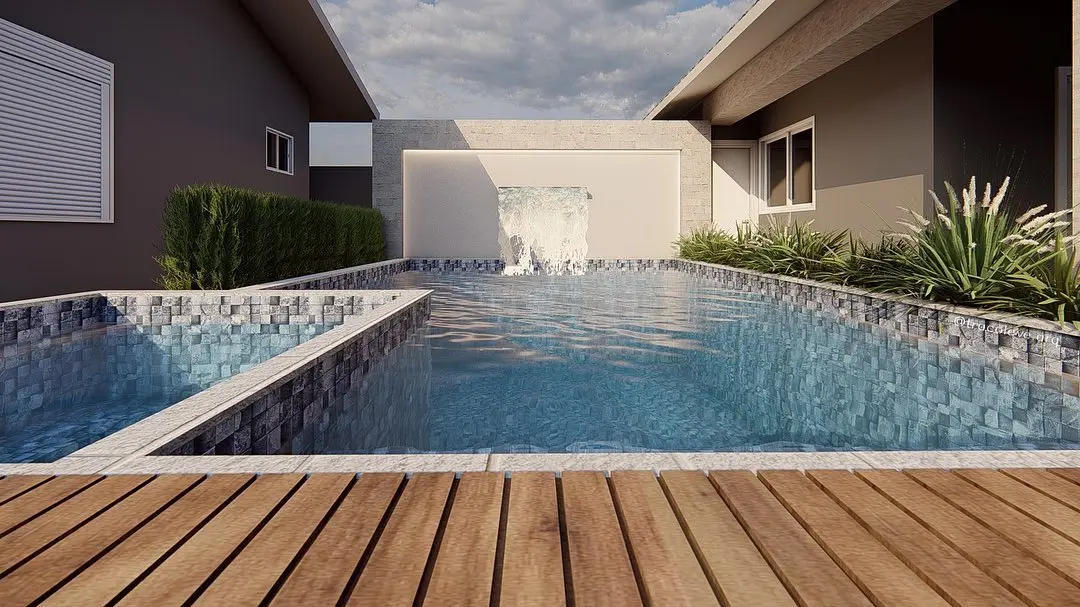 Render diurno da piscina com cascata ao fundo, revestimento azul e deck em primeiro plano